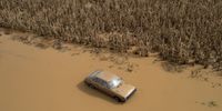 epa10998626 A picture taken with a drone shows a car in the flooded area of the village of Sotirio after Storm Elias, near Larissa, Greece, 28 September 2023.  EPA-EFE/ACHILEAS CHIRAS