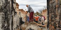 epaselect epa10273113 Volunteers  clean the debris of a house, destroyed in combat action in Novoselivka village, Chernihiv region, Ukraine, 29 October 2022.  A group of local people from Chernihiv and the nearby village Novoselivka, whose houses were destroyed or damaged during the Russian invasion, gathered to help each other to clean the debris of their houses and to restore them. As soon as people came back to their settlements the movement grew and transformed into the volunteer organization 'Bo Mozhemo' (Because we can) to which, more and more people, not only from Chernihiv but also from nearby towns and villages, join. The works focus also on reparing the roofs before upcoming winter.  EPA-EFE/OLEG PETRASYUK  ATTENTION: This Image is part of a PHOTO SET