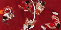 SAITAMA, JAPAN - JULY 26: Tina Krajisnik #33 of Team Serbia (top right) pulls down a rebound over Nirra Fields #21 (top middle) of Team Canada during the first half of the Men's Preliminary Round Group C game on day three of the Tokyo 2020 Olympic Games at Saitama Super Arena on July 26, 2021 in Saitama, Japan. (Photo by Bryan Snyder - Pool/Getty Images)