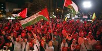 Iranian supporters of Hezbollah wave Palestinian flags in the Gaza Strip, in Tehran, Iran, 7 October 2023. (Photo: EPA-EFE / ABEDIN TAHERKENAREH)