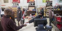 Portia Nyakama at her till point. She often educates customers on the importance of wearing a mask and observing physical distancing. (Photo: Shiraaz Mohamed)