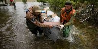 Volunteers deliver humanitarian aid to local residents in the village of Afanasiivka, Mykolaiv region, Ukraine, 12 June 2023, amid floods following the collapse of a major dam. Ukraine has accused Russian forces of destroying a critical dam and hydroelectric power plant on the Dnipro River in the Kherson region along the front line in southern Ukraine on 06 June. The villages of Novovasylivka and Afanasiivka had turned into islands as territories around the Inhulets River in the Mykolaiv region were flooded.  EPA-EFE/STAS KOZLIUK