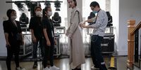 BEIJING, CHINA - MAY 05:  Models prepare backstage before DAMOWANG collection show by Chinese designer Han Lei during the China Fashion Week 2020/2021 A/W Collection on May 5, 2020 in Beijing, China. Affected by the coronavirus (COVID-19) pandemic, China Fashion Week will not have an audience at it's shows.  (Photo by Lintao Zhang/Getty Images)