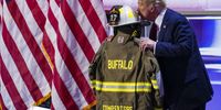 Republican presidential nominee and former President Donald J. Trump kisses the uniform of Cory Compertore, the retired firefighter killed in the assassination attempt, delivers remarks during the final day of the Republican National Convention (RNC) at the Fiserv Forum in Milwaukee, Wisconsin, USA, 18 July 2024. The convention comes just a few days after a 20-year-old Pennsylvania man attempted to assassinate former President and current Republican presidential nominee Donald Trump. The RNC is being held 15 to 18 July 2024 and is where delegates from the Republican Party select their nominees for president and vice president in the 2024 US presidential election.  EPA-EFE/SHAWN THEW