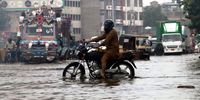 People with their vehicles make their way through a water-logged road after heavy monsoon rains in Karachi, Pakistan, 21 August 2025. Since the start of the monsoon season on 26 June, the death toll from rains and flooding in Pakistan has reached at least 748. The National Disaster Management Authority (NDMA) reported that an additional 978 people have been injured.  EPA/REHAN KHAN