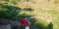 Young woman collects water from a communal tap at Khenana Informal settlement near Durban, they live in fear as the killings continue, 09 May 2022.Photo:Phumlani Thabethe