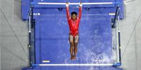 ST LOUIS, MISSOURI - JUNE 27:  Simone Biles competes on the uneven bars during the 2021 U.S. Olympic Trials at America’s Center on June 27, 2021 in St Louis, Missouri. (Photo by Jamie Squire/Getty Images)