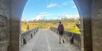 The Husband walking over the seven arch bridge at Puente la Reina, heading towards Estella, Spain, 7 August 2023. (Photo: Pauli van Wyk)