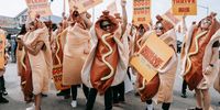 People wearing hot dog costumes react during Nathan's Famous Fourth of July International Hot Dog Eating Contest at Coney Island in the Brooklyn borough of New York, New York, 04 July 2024.  EPA-EFE/OLGA FEDOROVA