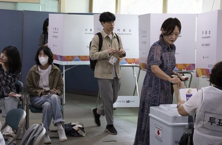 South Koreans turn out in record numbers for early voting as presidential hopefuls vow change