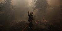 epaselect epa09370851 A firefighter at work to extinguish a wildfire in the area of Stamata, in north-eastern Athens, Greece, 27 July 2021. Firefighting forces are operating in the area of Stamata, in the Attica region, to contain a wildfire that broke out earlier in the day. Some 22 fire engines with 68 crew members, three teams of firemen on foot, the municipality's water trucks along with four firefighting aircraft, and five water dropping helicopters are currently battling the blaze which is very close to inhabited areas. In the meanwhile, the Civil Protection's emergency number 112 was activated in the wider region of Stamata and Rodopoli informing the citizens to be on alert and follow authorities' instructions.  EPA-EFE/YANNIS KOLESIDIS