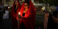  People participate in a 'Queer Procession' in a tribute to the victims of femicides and murdered transgender women, in San Salvador, El Salvador, 06 April 2024. Activists from the LGTBI community and feminists demanded justice for the victims of femicide and transgender women murdered in El Salvador with a 'queer procession'.  EPA-EFE/RODRIGO SURA
