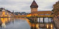 Dusk falls over Lucerne and the Kapellbrücke. Photographer: Brian Barnes
