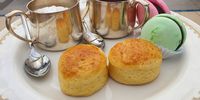 Scones and cream with jam and some French inspired macaroons. (Photo: Bridget Hilton-Barber)<br>