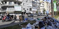 epa10535183 Protesters block the main road with garbage bins as they take part in a protest against the economic situation in the country, the high cost of living and the low purchasing power of the Lebanese pound, in Beirut, Lebanon, 21 March 2023. The Lira on parallel markets was traded at 110,000 per US dollar on 22 March, which is about more than eight times the official rate of 15,000 against the US currency.  EPA-EFE/WAEL HAMZEH