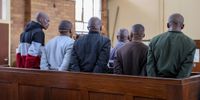 SOWETO, SOUTH AFRICA - DECEMBER 05: Nomzamo Tavern shooting suspects return to Orlando Magistrate's Court on December 05, 2022 in Soweto, South Africa. It is reported that 16 people were killed when gunmen opened fire on patrons of Mdlalose's Tavern in Nomzamo Park in July this year. (Photo by Gallo Images/Papi Morake)