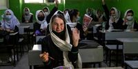 KABUL, AFG- JULY 25: Zinat Karimi, 17, raises her hand during 10th-grade class at the Zarghoona high school on July 25 2021 in Kabul, Afghanistan. The Zarghoona girls high school is the largest in Kabul with 8,500 female students attending classes. The school opened after almost a two months break due to the coronavirus (COVID-19) pandemic. Currently, there is widespread fear that the Taliban who already control around half the country will reintroduce its notorious system barring girls and women from almost all work, and access to education. The Ministry of Education has announced the opening of schools, but there are mixed reports in many areas where the Taliban have taken control or where fighting is ongoing. (Photo by Paula Bronstein /Getty Images)