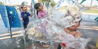 IMPERIAL, CA-JUNE 12: Kids play at a water park as the temperature reaches 115 degrees on June 12, 2022 in Imperial, California.  Much of the Southwest is being gripped by a heatwave sending temperatures from California to Texas into the triple-digit range. (Photo by Sandy Huffaker/Getty Images)