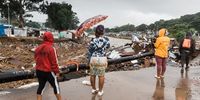 Women on the road to the bridge over the Palmiet River survey the flood damage. The bridge was blocked with debris so the water was unable to flow under it. Infrastructure can sometimes increase risk and is often destroyed by floods. (Photo: Rajesh Jantilal)