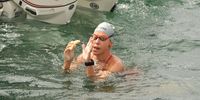 Carina taking a break during her marathon swim to cross Nelson Mandela Bay. Picture by Mike Holmes