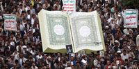 Yemenis gather around a mockup of the Koran during a protest against the desecration and burning of the Koran, in Sana'a, Yemen, 24 July 2023. Thousands of Yemenis staged a protest in Sana'a against Sweden and Denmark for allowing anti-Islam activists to desecrate and burn copies of the Muslim holy book of the Koran in Stockholm and Copenhagen.  EPA-EFE/YAHYA ARHAB