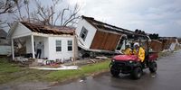 GOLDEN MEADOW, LOUISIANA - SEPTEMBER 01: A search and rescue team from Texas works outside a home destroyed by Hurricane Ida September 1, 2021 in Golden Meadow, Louisiana. Ida made landfall August 29 as a Category 4 storm southwest of New Orleans, causing widespread power outages, flooding and massive damage. (Photo by Win McNamee/Getty Images)