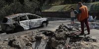 Two persons stand near a shell hole after debris fell outside an apartment building in a drone strike in Kyiv (Kiev), Ukraine, 30 May 2023, amid the Russian invasion. At least one person died and seven others injured after a Russian strike against the the Ukrainian capital, the Kyiv City Military Administration said on telegram. On 30 May Russian forces launched 31 'kamikaze' drones on Ukraine, 29 of which were shot down, said the Air Force Command of the Armed Forces of Ukraine. Russian troops entered Ukrainian territory in February 2022, starting a conflict that has provoked destruction and a humanitarian crisis.  EPA-EFE/SERGEY DOLZHENKO