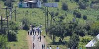 A group of Buje Junior Secondary School learner's returning from school , infront of them are some of their homesteads who were torched, kids uniforms were burnt there in those houses by group of men's in Buje Village under Majola Administrative Area in Port St John's,  Eastern Cape on 18 January 2023. ( Photo: Hoseya Jubase).