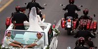Jordanian Crown Prince Hussein (L) and his wife, Princess Rajwa Al Saif (R), of Saudi Arabia, wave to people lining the street during a wedding parade after their royal wedding ceremony in Amman, Jordan 01 June 2023. The wedding was held at Zahran Palace attended by Jordan's king and queen, the parents of the bride, and international royals and heads of state.  EPA-EFE/MOHAMMAD ALI