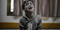 An injured boy cries at a hospital as the Israeli attacks continue  in Deir Al-Balah, Gaza on 7 November 2023. (Photo: Belal Khaled / Anadolu / Anadolu via AFP)