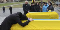 epa09873710 Relatives of Ukrainian servicemen killed in action attend their funeral in Lviv, Ukraine, 06 April 2022. On 24 February, Russian troops entered Ukrainian territory to carry out what the Kremlin refers to as a 'special military operation', resulting in fighting and destruction in the country, a huge flow of refugees, and multiple sanctions against Russia.  EPA-EFE/MYKOLA TYS