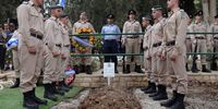 Soldiers stand at the grave of Israeli soldier Yuval Ben Yaakov, who died during fighting with Hamas militants on the border with the Gaza Strip, during his funeral in the kibbutz of Kfar Menahem, southern Israel,  on 9 October 2023. (Photo: EPA-EFE/Abir Sultan)