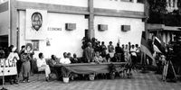 Memorial for Ruth First at Eduardo Mondlane University, Maputo. Albie seated in front of portrait. At table: Jacob Zuma, interpreter standing, Moses Mabhida, Fernando Ganhao (rector), Joe Slovo and Malumi. (Photo: thealbiecollection.org)