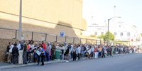 People queue outside the SASSA office to exchange SASSA cards for the new Postbank Black Cards on 14 February 2025 in Bellville, South Africa. SASSA and Postbank appeal to social grant beneficiaries to replace their SASSA Gold Cards with the new Postbank Black Cards. (Photo: Gallo Images / Die Burger / Jaco Marais)