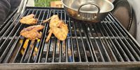 Smokey BBQ wings on the grill at Eadi’s Kitchen (Food Made With Love). (Photo: Naomi Campbell)<br>