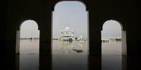 A view of historic Gurdwara Kartarpur Sahib, the final resting place of the founder of Sikhism, Guru Nanak, submerged after rising flood water in river Ravi, in Naorwal district in Punjab province, Pakistan, 28 August 2025. The crisis, which has led to the evacuation of over 174,000 people and has killed some 799 nationwide, was caused by monsoon rains and, according to Pakistani authorities, aggravated by India's release of water from two dams.  EPA/RAHAT DAR