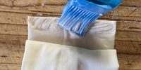'Glue' the top edge and complete the rolling up. Then press down.