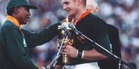 Nelson Mandela hands Francois Pienaar the Rugby World Cup trophy after the South African Springboks beat the New Zealand All Blacks at Ellis Park on June 24, 1995 in Johannesburg, South Africa (Photo by Wessel Oosthuizen/Gallo Images)