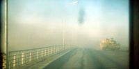British armoured vehicles cross Bridge Four near Basra, April 2003. (Photo: EPA-MOD pool / Giles Penfound)