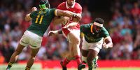 Cai Evans of Wales is tackled by Siya Kolisi and Cheslin Kolbe of South Africa during the Summer International match between Wales and South Africa at Principality Stadium on 19 August 2023 in Cardiff, Wales. (Photo: Warren Little / Getty Images)