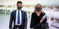 WASHINGTON, DC - FEBRUARY 25: Rep. Marjorie Taylor Greene (R-GA) wears a protective mask bearing the words "This mask is as useless as Joe Biden," as she walks with an aide to a vote in the Cannon Tunnell on Capitol Hill, on February 25, 2021 in Washington, DC. (Photo by Al Drago/Getty Images)