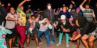NKANDLA, SOUTH AFRICA - JULY 07: Jacob Zuma supporters dance and block the entrance to Jacob Zuma's homestead on July 07, 2021 in Nkandla, South Africa. The former president was found guilty of contempt of court by the Constitutional Court of South Africa and has been sentenced to 15 months imprisonment. (Photo by Gallo Images/Darren Stewart)