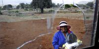 Unemployed Diale Mokoka holds her food hamper. (Photo: Lucas Ledwaba / Mukurukuru Media)