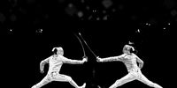 CHIBA, JAPAN - JULY 24:  (EDITORS NOTE: Image has been converted to black and white.) Junghwan Kim of Korea (R) and Luigi Samele of Italy (L) compete in the men’s sabre individual semi final 2of the fencing on day one of the Tokyo 2020 Olympic Games at Makuhari Messe Hall on July 24, 2021 in Chiba, Japan. (Photo by Matthias Hangst/Getty Images)