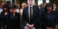 Britain's then Labour leader Jeremy Corbyn, centre, stands for a minute's silence for the victims of the Manchester attack, before delivering a speech in London, 26 May 2017. Corbyn said that the war on terror had failed and that foreign policy would change under a Labour government. (Photo: EPA / Andy Rain)
