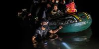 ROMA, TEXAS - AUGUST 14: A smuggler guides a group of immigrants across the Rio Grande to cross the border from Mexico on August 14, 2021 in Roma, Texas. Recent U.S. Customs and Border Protection figures show more than 200,000 people were apprehended at the border in July, the highest number in 21 years. More than 82,000 of those were family members traveling together. (Photo by John Moore/Getty Images)
