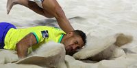 epa11181088 Alisson (Front) of Brazil in action against Josep Junior Gentilin of Italy during the FIFA Beach Soccer World Cup UAE 2024 final match between Brazil and Italy in Dubai, United Arab Emirates, 25 February 2024.  EPA-EFE/ALI HAIDER