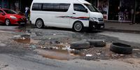 Potholes along Lilian Ngoyi Street on February 20, 2023 in Johannesburg, South Africa. It is reported that the South African National Roads Agency (SANRAL) has disputed the claim that  the country has 25 million potholes on its roads. (Photo: Gallo Images/Luba Lesolle)
