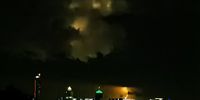 Lightning lighting up the clouds behind Sandton. Photographer: Graeme Adamson <br>