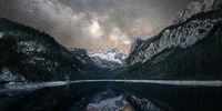Milky Way in Salzkammergut. "I planned this photo for about a year, and on that night in June 2021 the conditions were just perfect. The Gosausee lake in Salzkammergut reflects its surrounding mountains beautifully, especially the mountain Dachstein with its glacier. The picture blends two images, one taken in the blue hour, and one taken at about midnight." © Sonja Ivancsics, Austria, Winner, National Awards, Landscape, 2022 Sony World Photography Awards